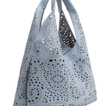 Perforated gray handbag on a white background