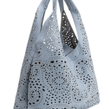 Perforated gray handbag on a white background