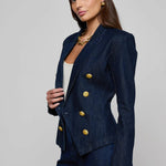 Navy structured blazer styled over a simple top.
