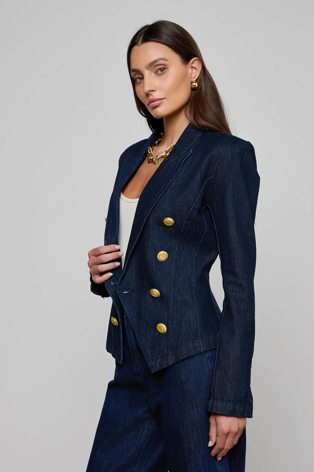 Navy structured blazer styled over a simple top.