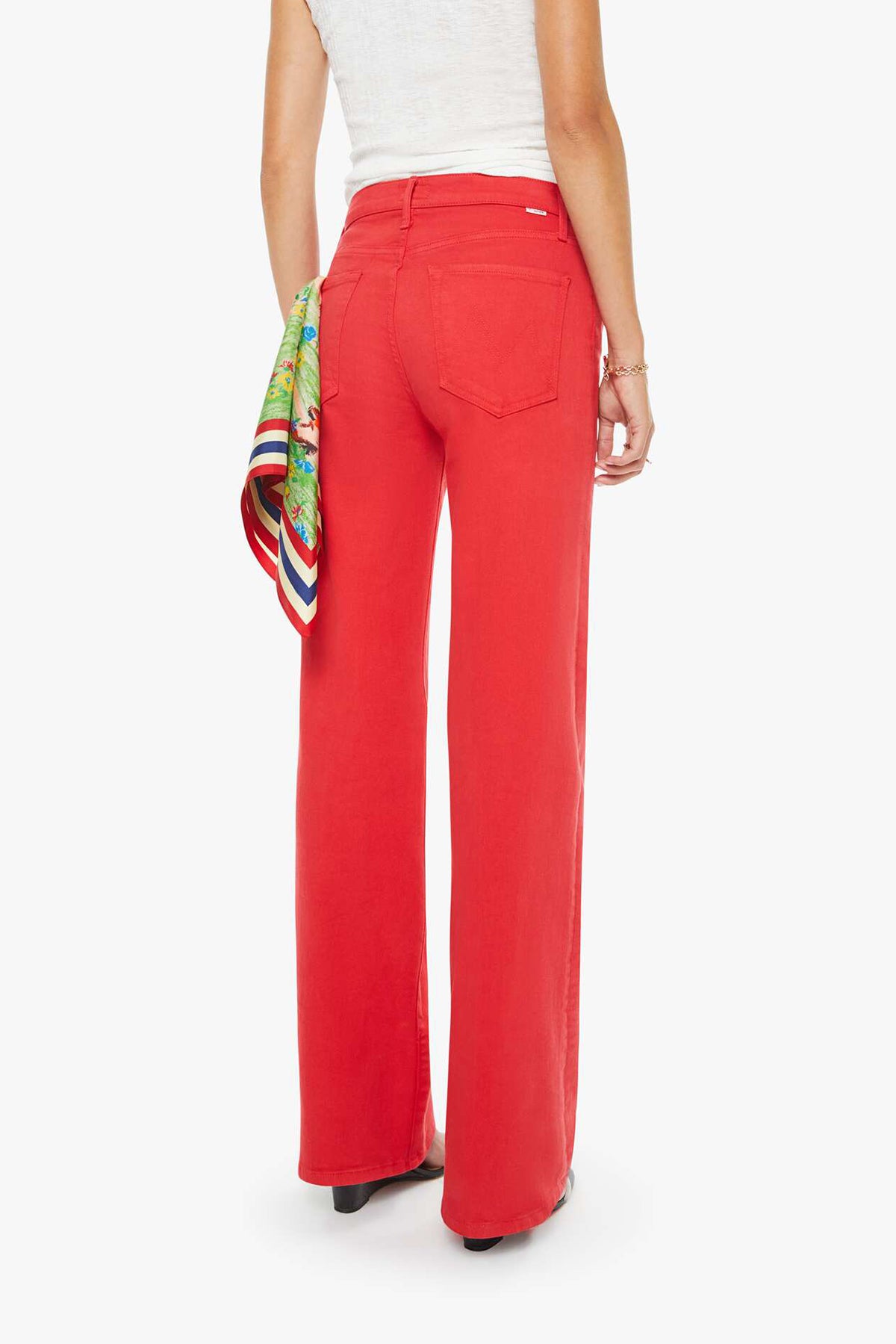 Person wearing red pants with a colorful scarf on a white background