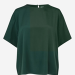 A dark green short-sleeve top with a color-blocked design, featuring a solid dark green upper chest and a slightly lighter forest green lower half, shown against a plain light gray background.