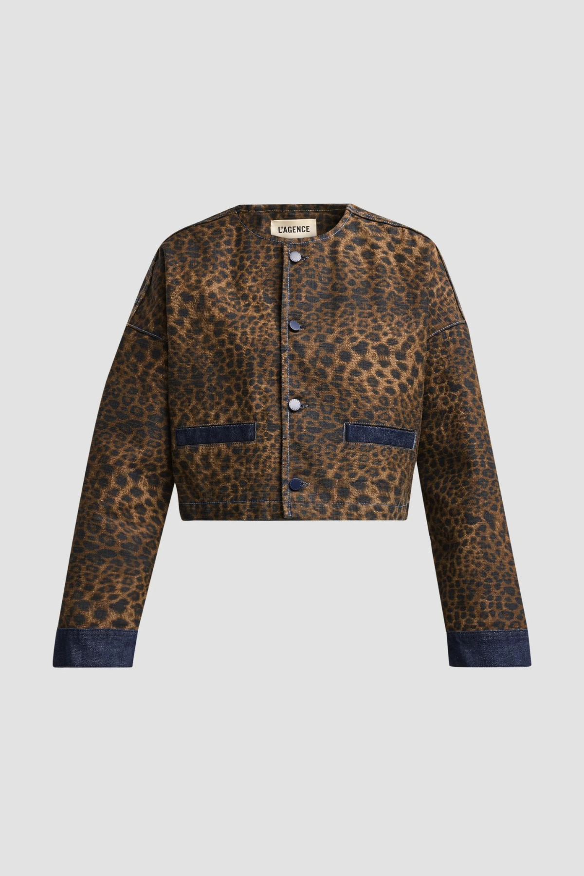 Women's neutral collarless jacket featuring long sleeves and a structured silhouette.