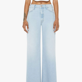 Light blue wide-leg jeans worn by a person on a white background