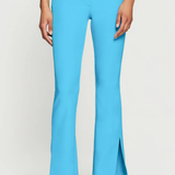 Blue pants worn by a person on a white background
