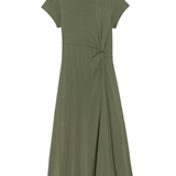 Green dress with a knot detail on a white background