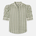 Model wearing a light green printed blouse with a relaxed silhouette
