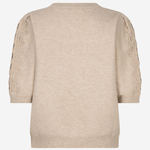 A beige knit sweater shown from the back, featuring textured, raised sleeve detailing, on a plain light gray background.