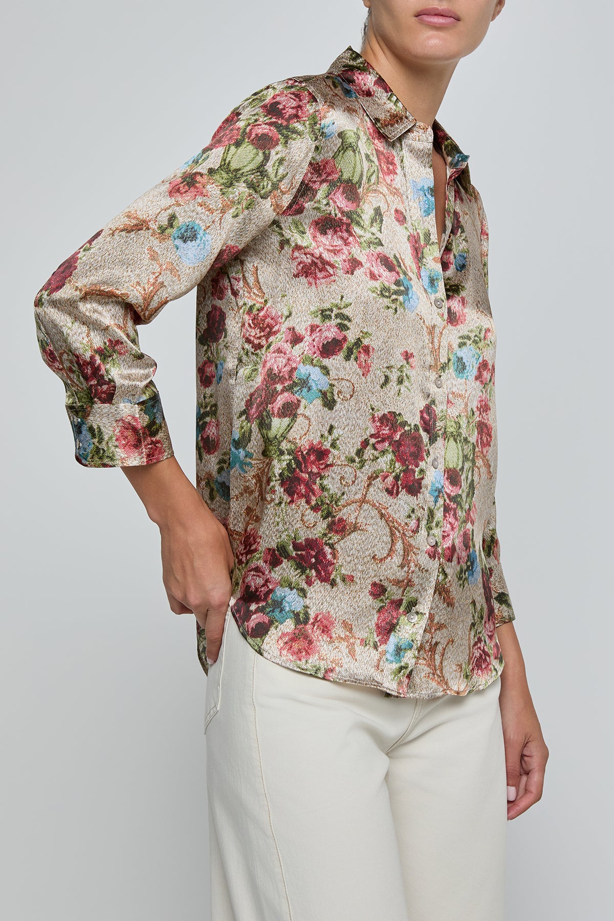 Floral patterned shirt worn by a person on a plain background