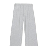 Woman wearing light grey knit pants with a straight leg silhouette, styled in soft studio lighting.