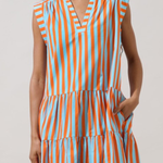model wearing Sleeveless tiered midi dress featuring vertical orange, blue, and cream stripes with a relaxed, flowing silhouette.