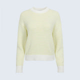 Yellow and white striped sweater on a light gray background