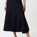 Person wearing a black skirt on a white background