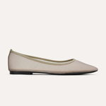Beige flat shoe on a white background