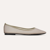Beige flat shoe on a white background