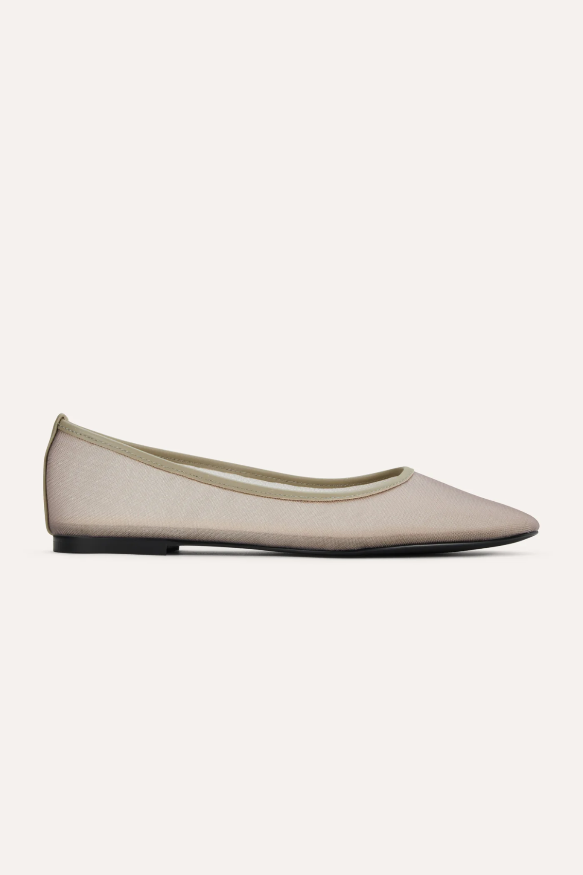 Beige flat shoe on a white background