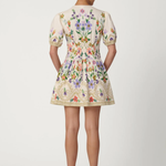 Woman wearing a floral dress on a white background
