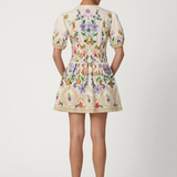Woman wearing a floral dress on a white background