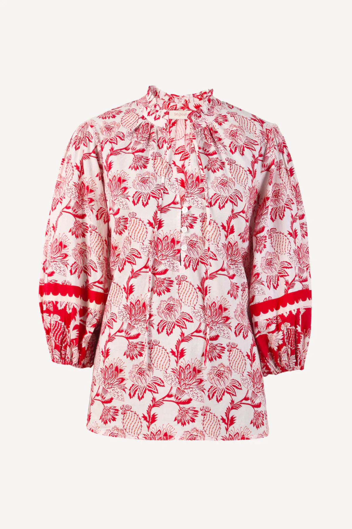 red printed long sleeve blouse on a white background