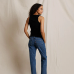 back of woman in black tank top and denim 