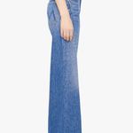 Model wearing light-wash straight-leg denim jeans with a cropped ankle-length silhouette.