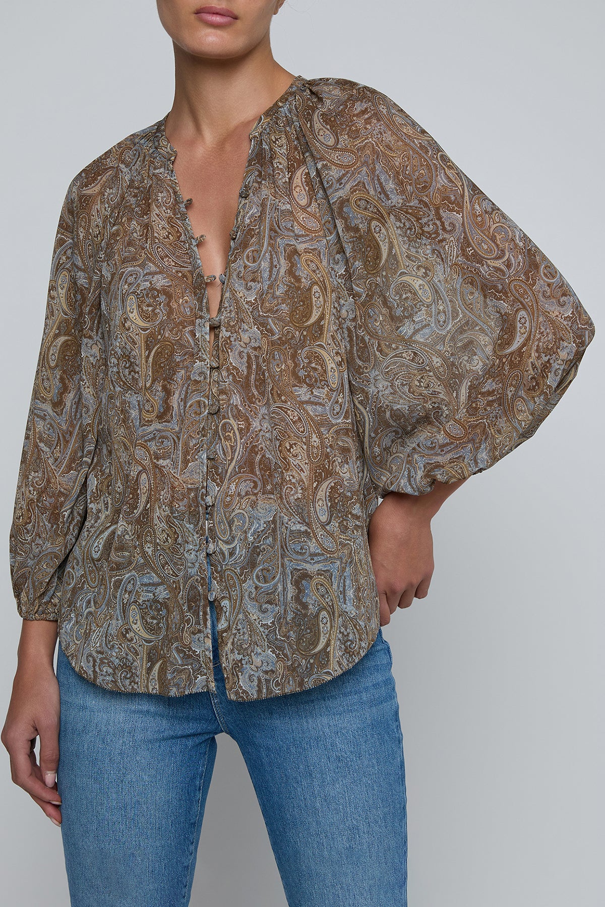 Blouse with dolman sleeves and fluid drape in a soft neutral hue