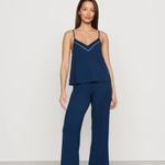 Navy blue Tencel™ modal pajama set featuring a V-neck camisole and matching full-length pants.