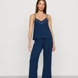Navy blue Tencel™ modal pajama set featuring a V-neck camisole and matching full-length pants.