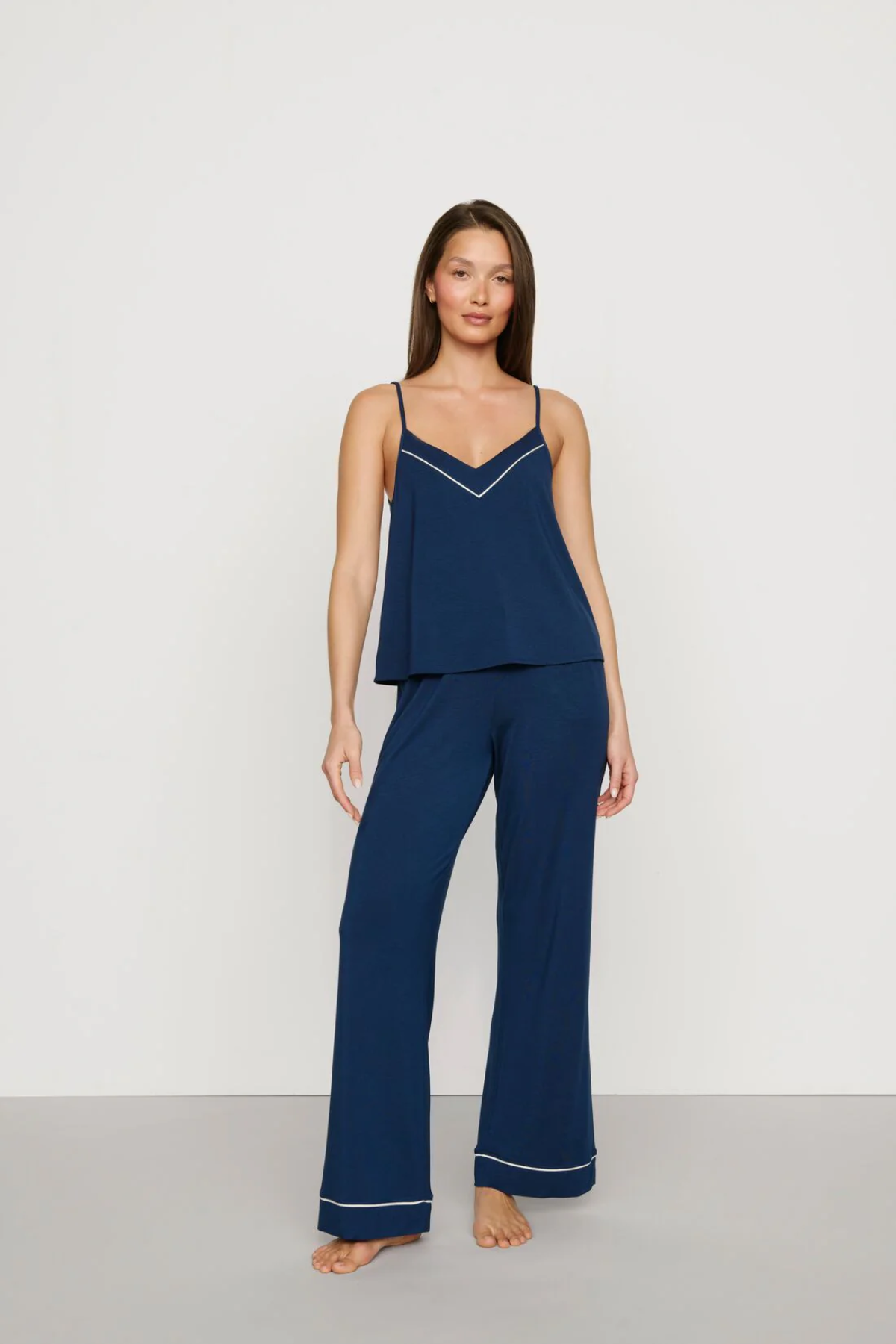 Navy blue Tencel™ modal pajama set featuring a V-neck camisole and matching full-length pants.