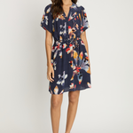 Woman wearing a floral dress on a white background