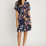 Woman wearing a floral dress on a white background