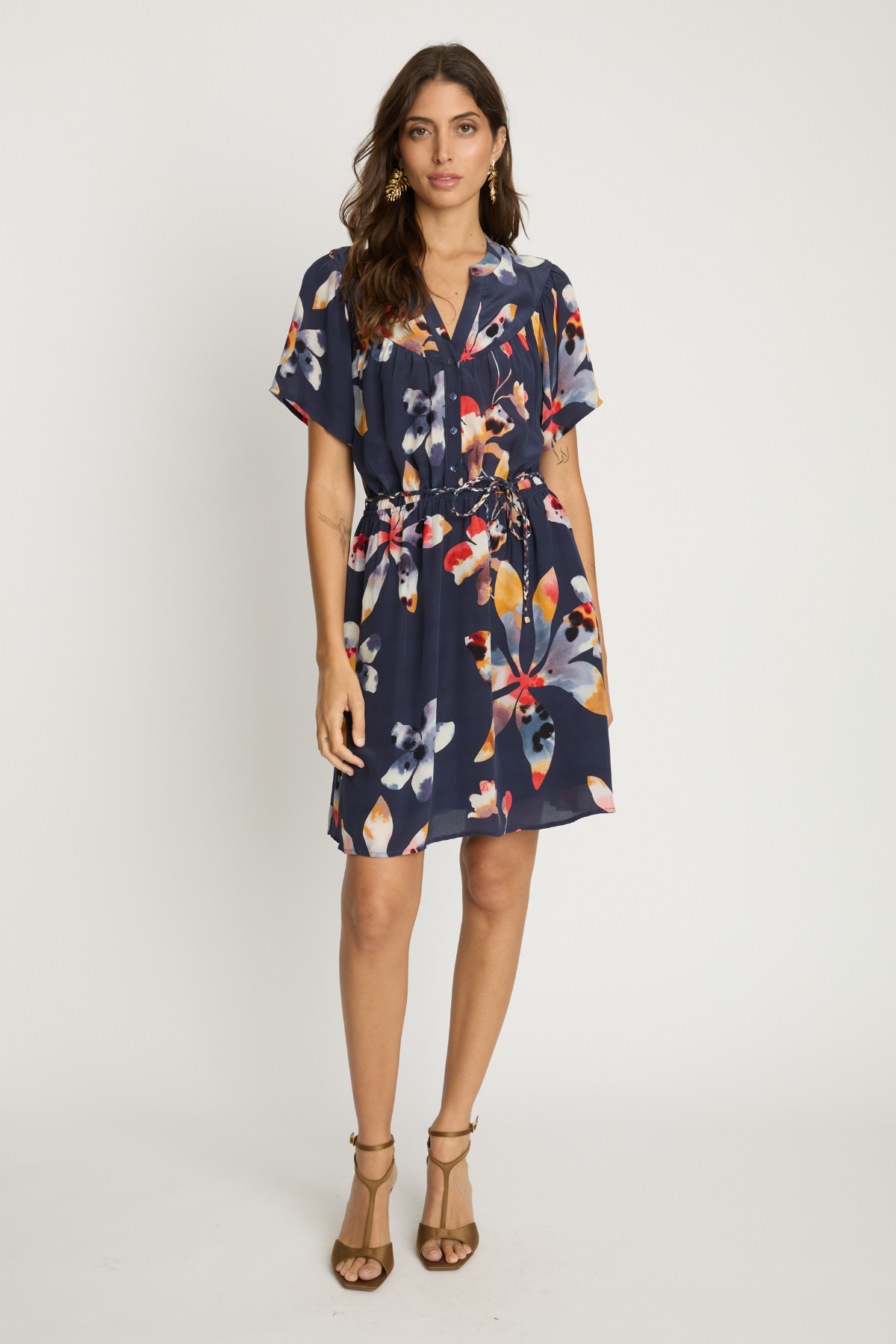 Woman wearing a floral dress on a white background