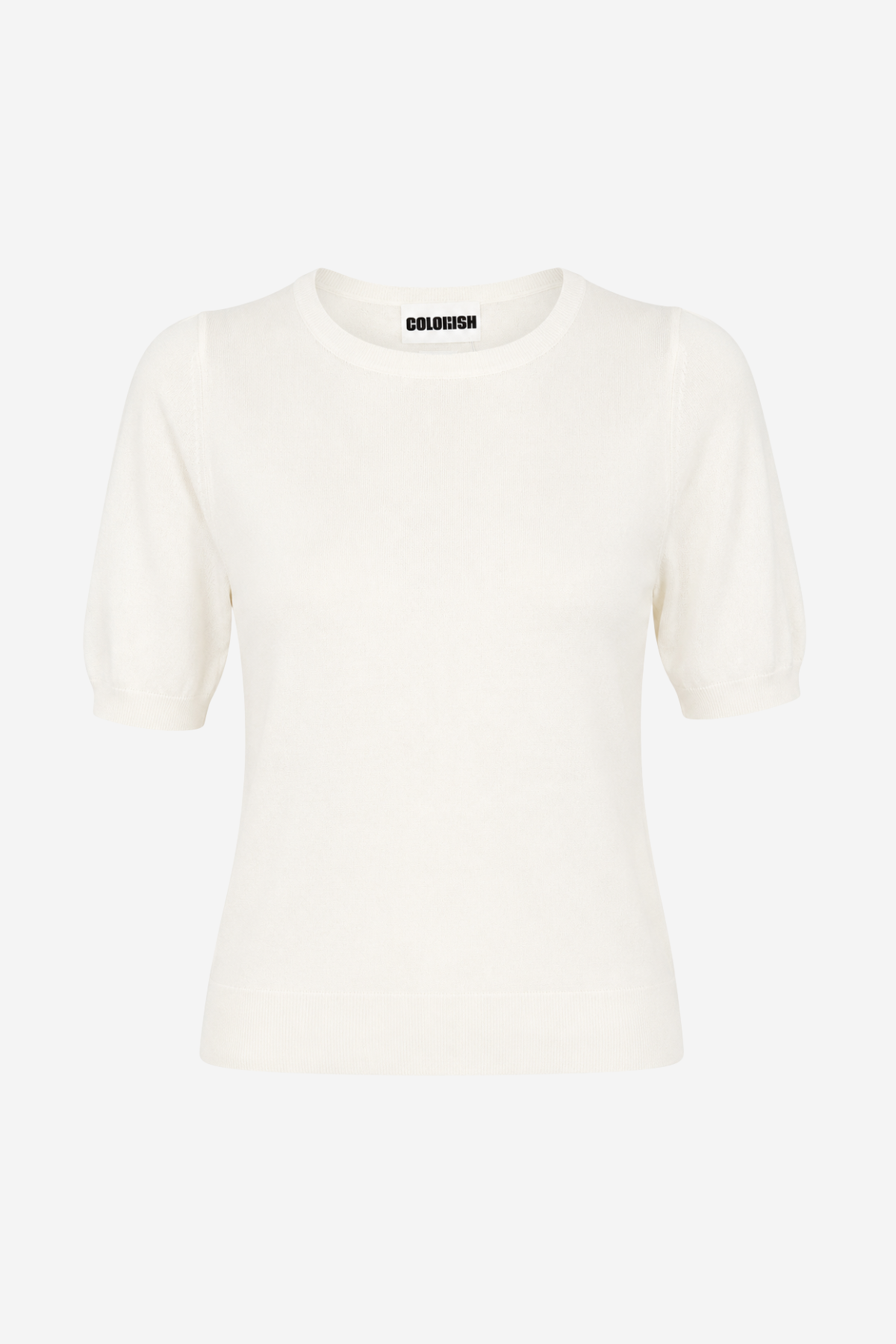 An off-white short-sleeve knit top with a crew neck and a small black label printed inside the collar, shown against a plain light gray background.