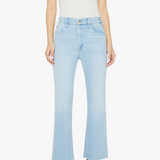 Person wearing light blue jeans and a white top on a white background
