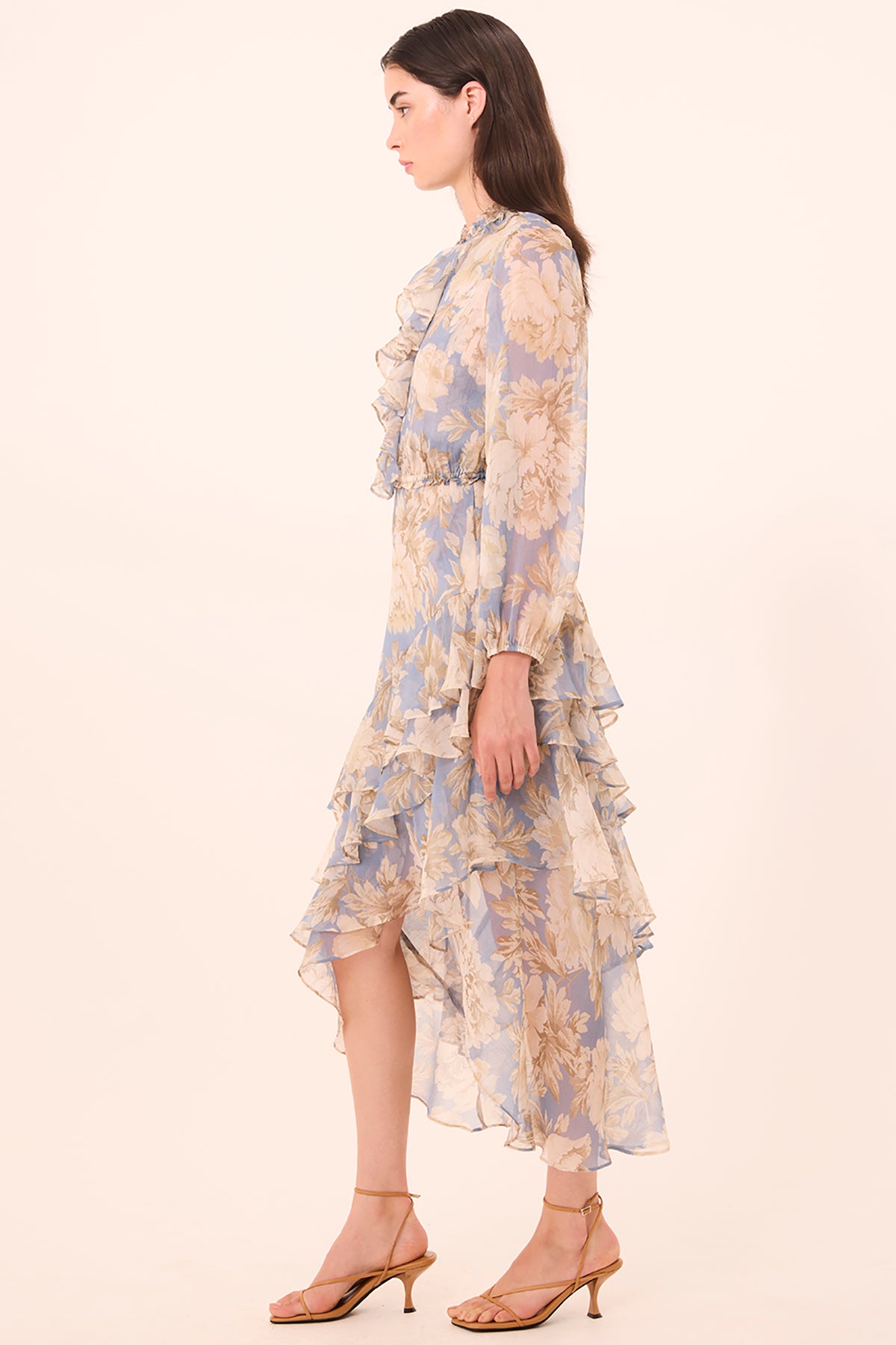 Woman wearing a floral dress on a white background