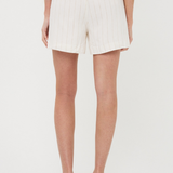Person wearing white shorts on a plain background