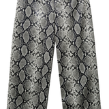 Wide-leg cropped pants featuring a gray and black snakeskin pattern, displayed against a solid white background.
