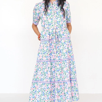 Woman wearing a floral dress on a white background