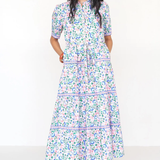 Woman wearing a floral dress on a white background