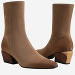 A pair of women's ankle boots in a warm taupe-brown suede-like material, featuring a low block heel and a light wood-textured heel accent, shown against a plain white background.