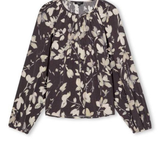 A long-sleeve blouse with a dark brown base and an off-white floral print, displayed flat against a white background.