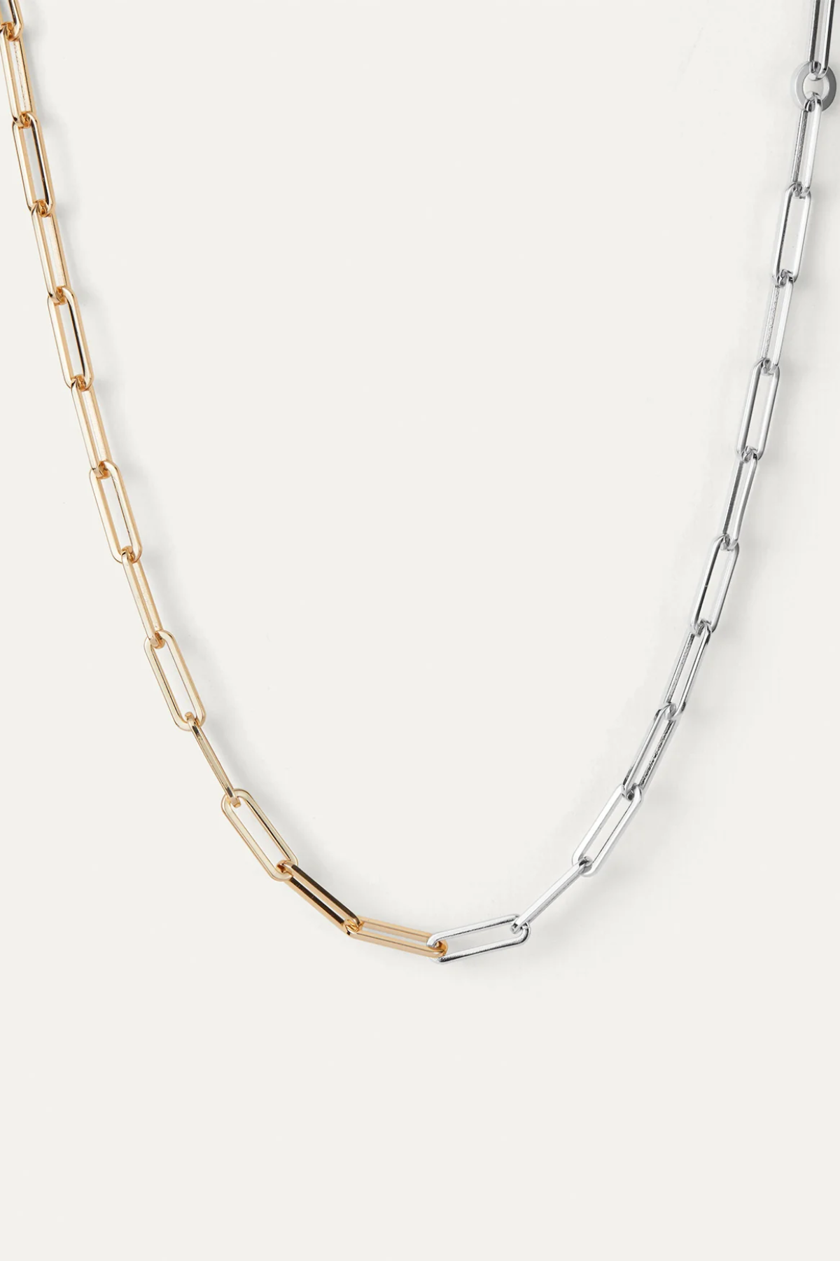 Two-tone gold and silver chain necklace on a white background