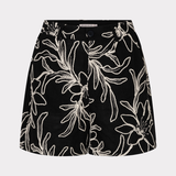 Black skirt with white floral pattern on a light gray background