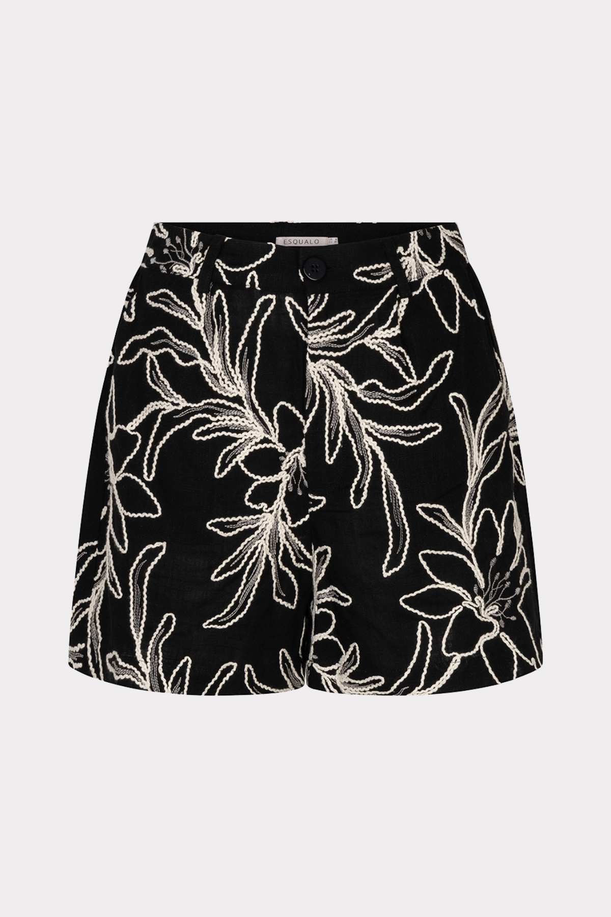 Black skirt with white floral pattern on a light gray background