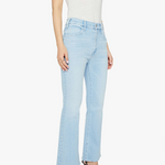 Light blue jeans worn by a person on a white background
