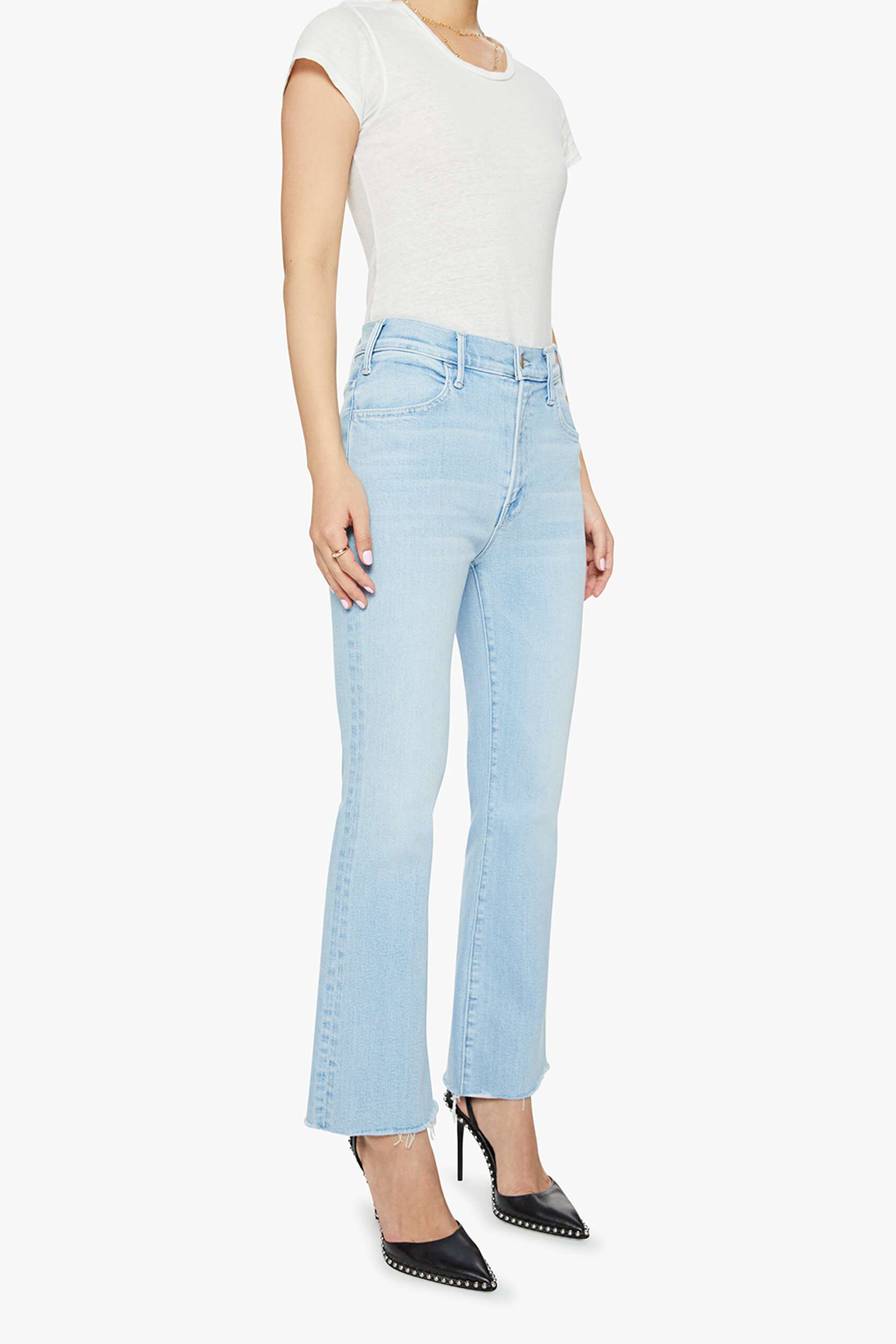 Light blue jeans worn by a person on a white background