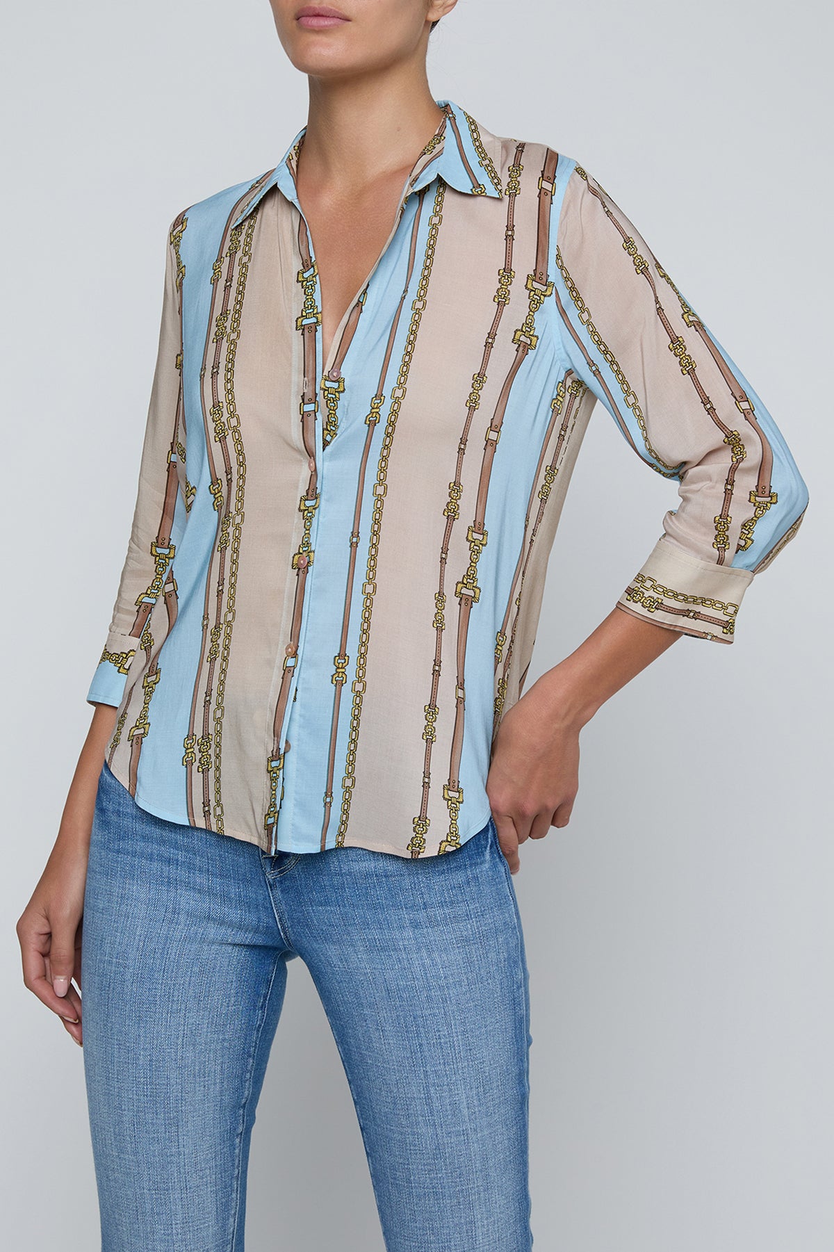 Three-quarter sleeve blouse with a soft stripe pattern.
