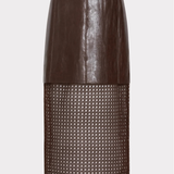 A dark brown faux-leather and mesh skirt with a matching belt, shown on a model wearing brown knee-high boots against a light gray background.