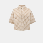 A beige faux-fur cropped jacket with a stand-up collar, short sleeves, and a chevron quilted pattern, shown against a plain light gray background.