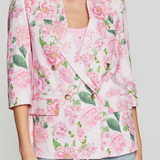woman in floral printed blazer on white background 